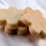 Close up image of flower shaped lotion bars.