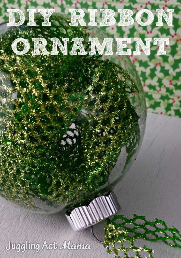 Close up image of a DIY Clear Christmas Ornament filled with green ribbon.