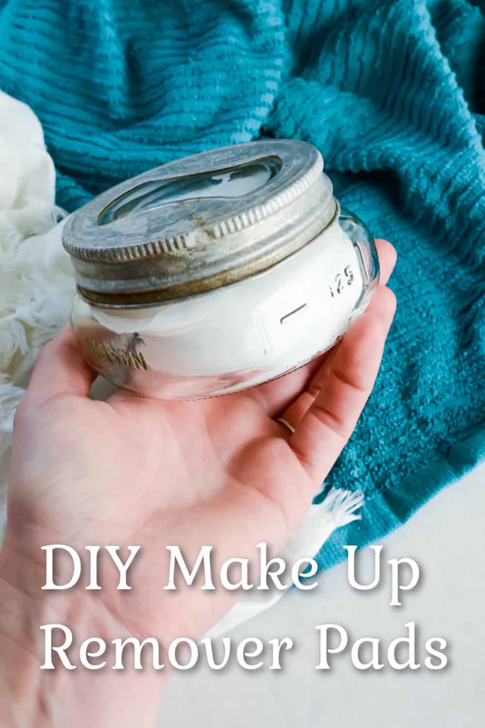 Woman holding a jar of DIY Make Up Remover Pads.
