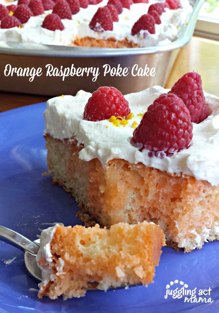 Close up image of Orange Raspberry Poke Cake on a blue plate with a fork filled with cake.

