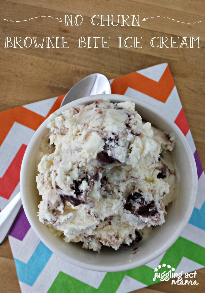 A small bowl of No Churn Vanilla Ice Cream with brownie bites sits on a chevron patterned rainbow napkin with a spoon.