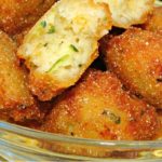 Zucchini Hushpuppies Recipe piled in a bowl for snacking.