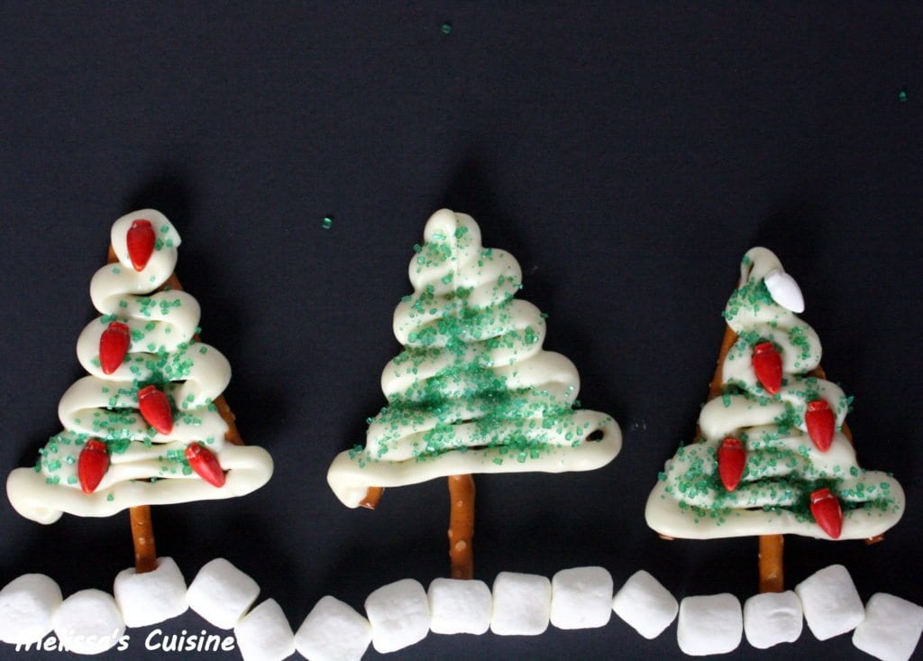 White Chocolate Christmas Trees on a black background with mini marshmallow snow.