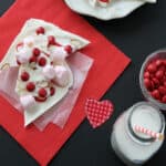 Strawberry almond bark on a red napkin.