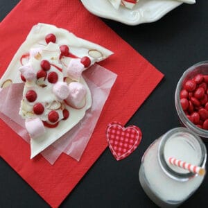 Strawberry almond bark on a red napkin.