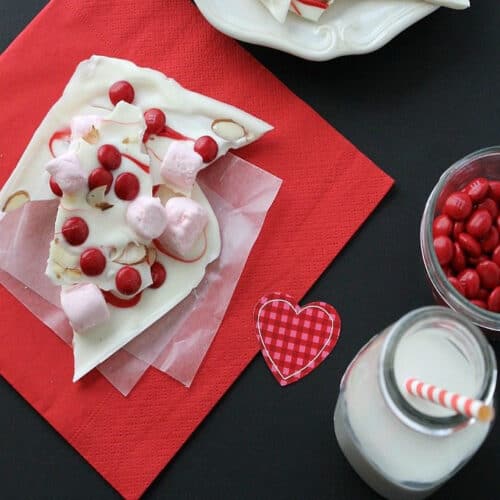 Strawberry almond bark on a red napkin.