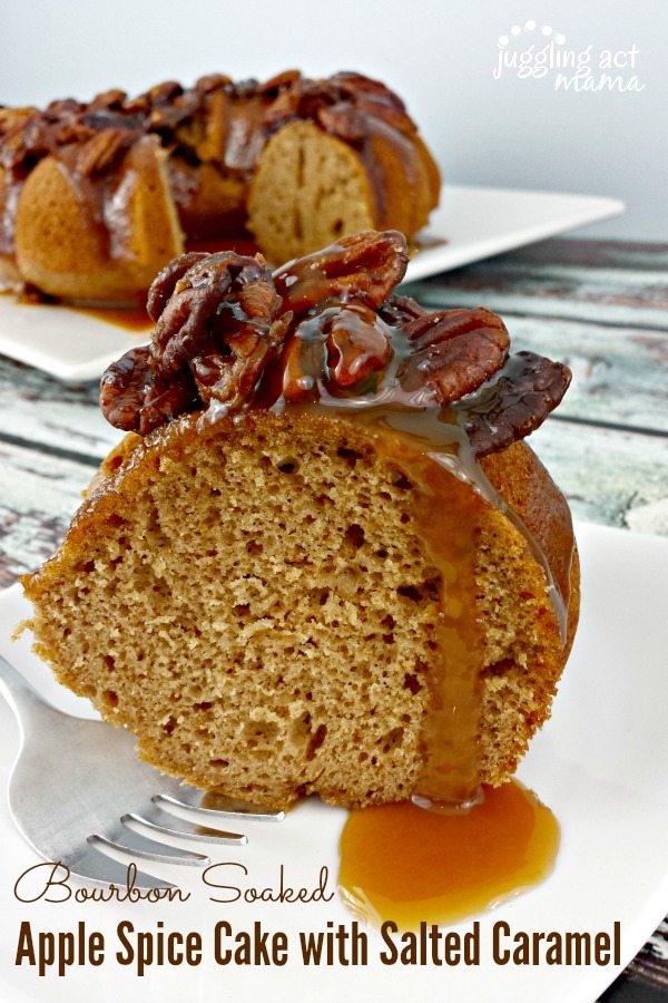 Bourbon Soaked Apple Spice Cake topped with pecans and Salted Caramel on a white plate