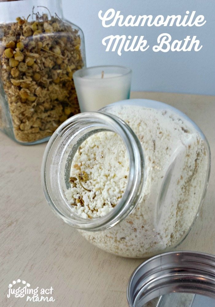Close up image of chamomile milk bath in a small glass jar.
