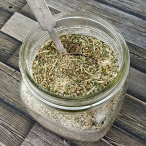 Close up image of a jar filled with homemade Italian Seasoning.