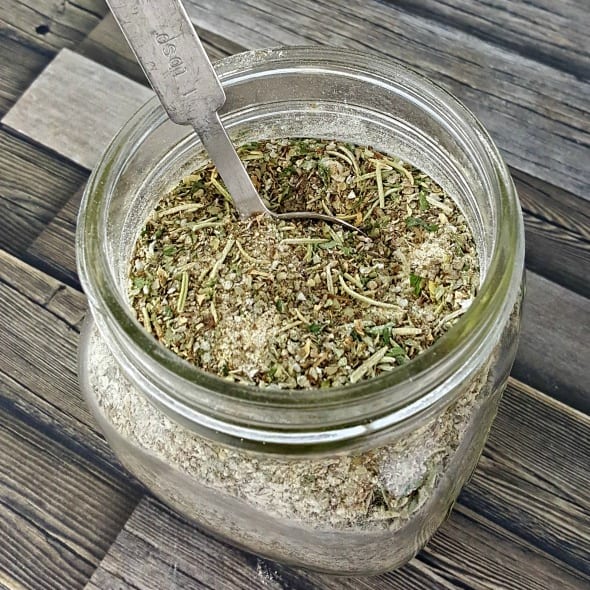Close up image of a jar filled with homemade Italian Seasoning.