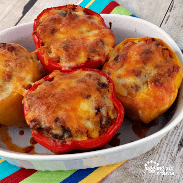 Chili stuffed peppers in a baking dish.