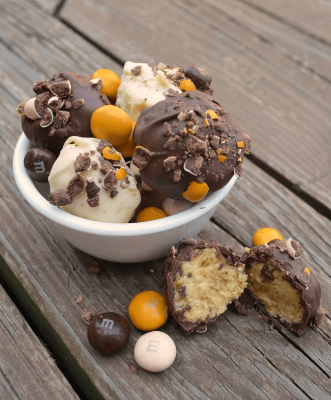 Pecan Pie Cake Balls with seasonal M&Ms in a bowl.