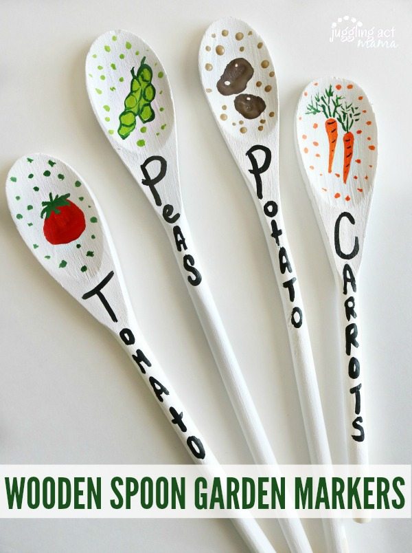 Close up of painted Wooden Spoon Garden Markers.
