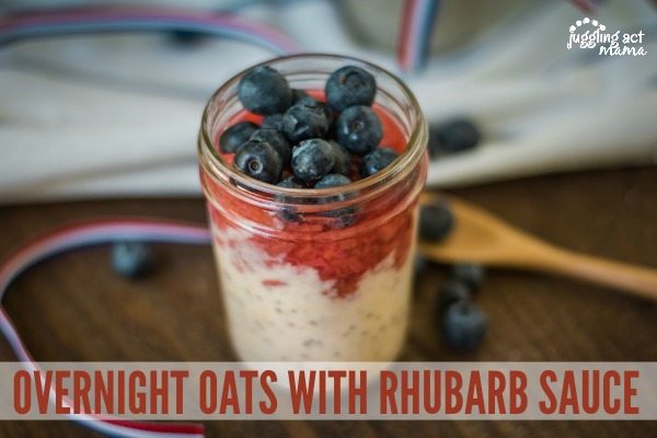 Horizontal image of overnight oats with rhubarb sauce and fresh blueberries.