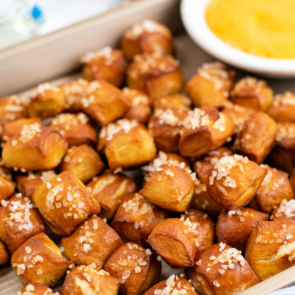 Close up image of pretzel bites topped with sea salt. 