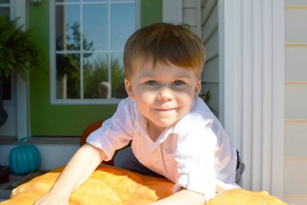 Toddler smiling at the camera.