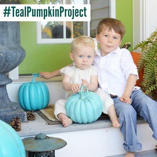 Teal Pumpkin Project with two toddlers sitting on a porch.