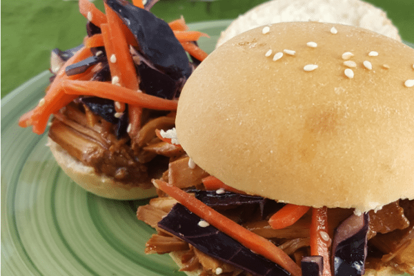 Close up images of Slow Cooker Pulled Pork Sliders and Asian Slaw.