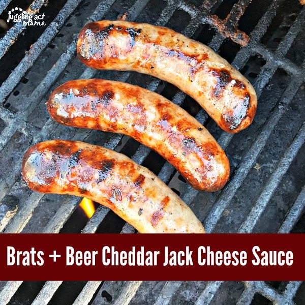 Brats cooking on a grill.