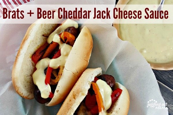 Brats with peppers, onions, and beer cheese sauce.