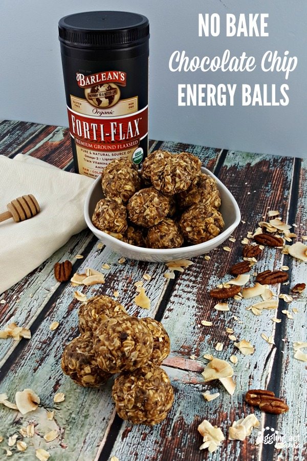 Oatmeal Peanut Butter Chocolate Chip Balls piled on a table next to a white bowl filled with them.