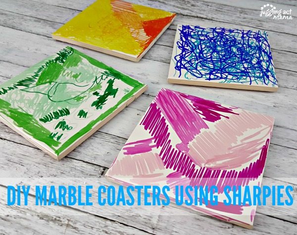 Four DIY Marble Coasters in various colors and designs.