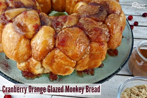 Cranberry Orange Glazed Monkey Bread on a cake plate.