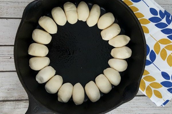 Garlic roll dough in a skillet.