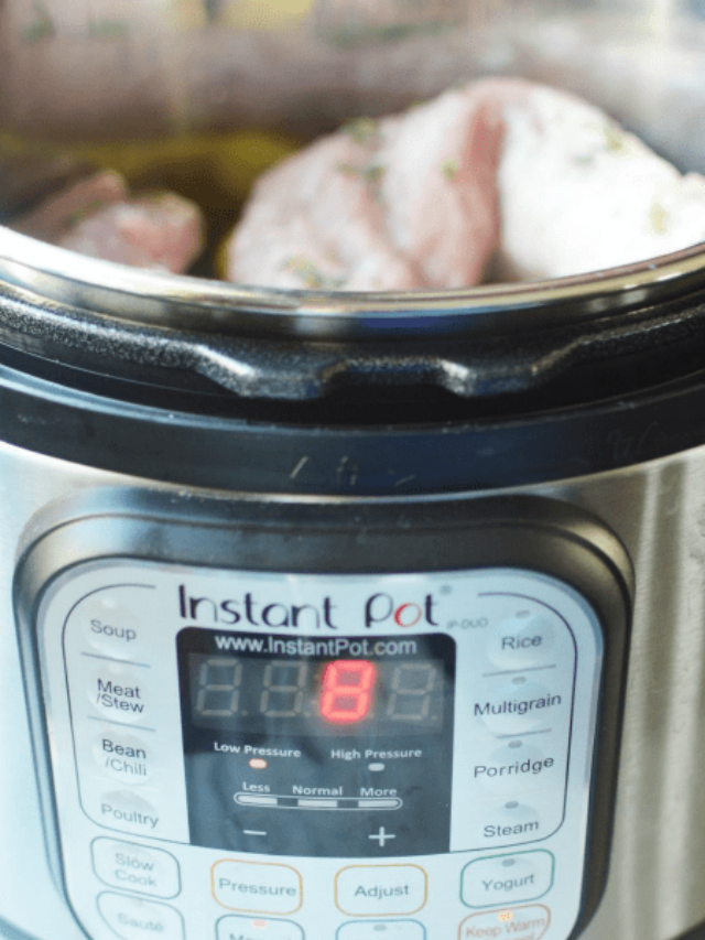 A close up of an Instant Pot reading 8 minutes with pork tenderloin inside.
