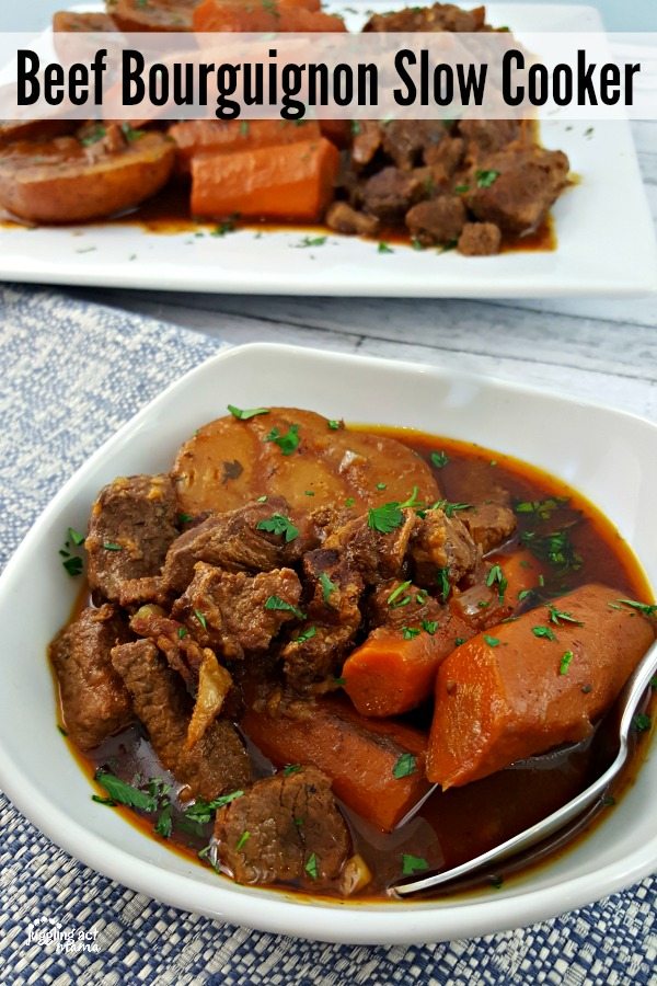 Large bowl of Beef Bourguignon on a table.