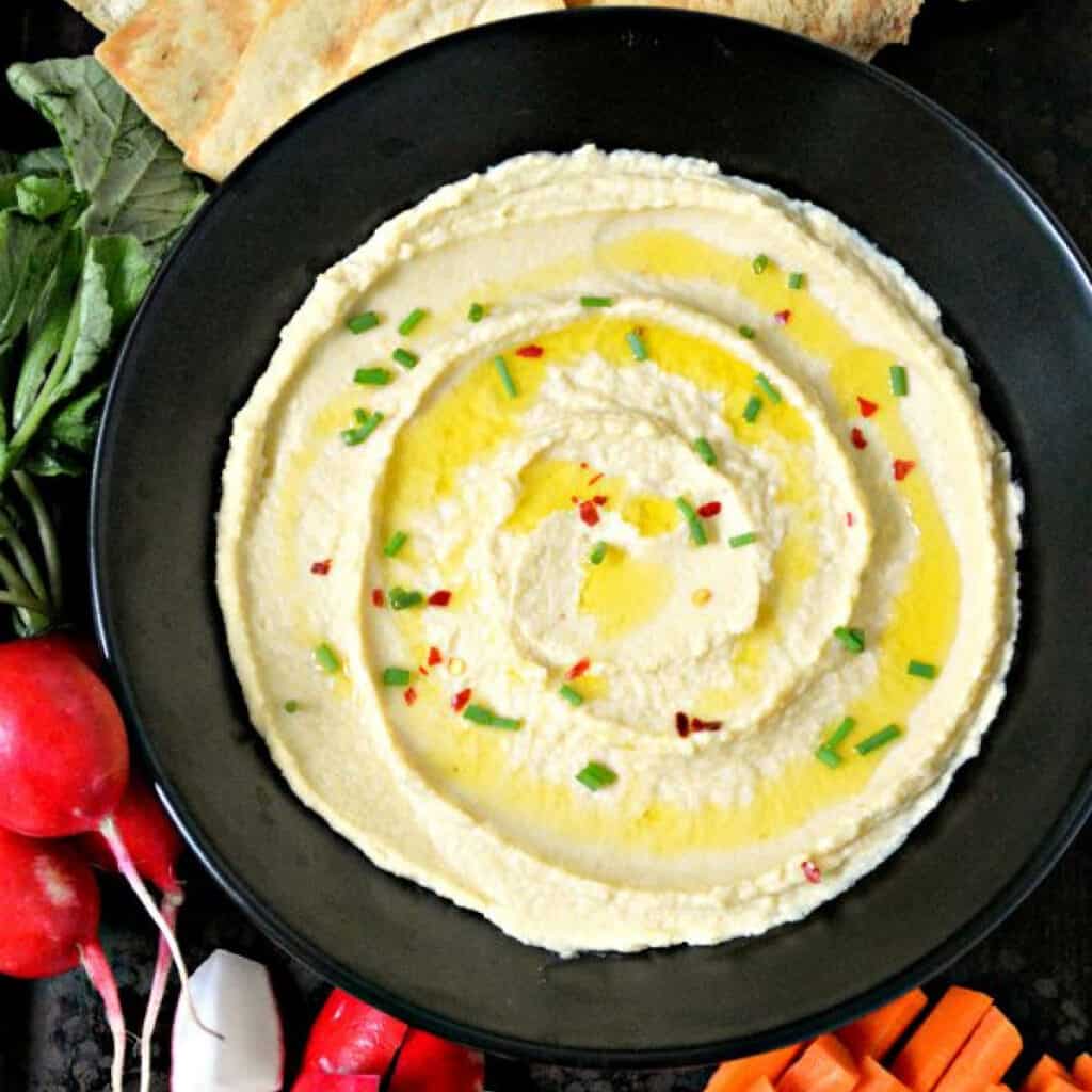 Close up of Roasted Garlic Hummus in a bowl.