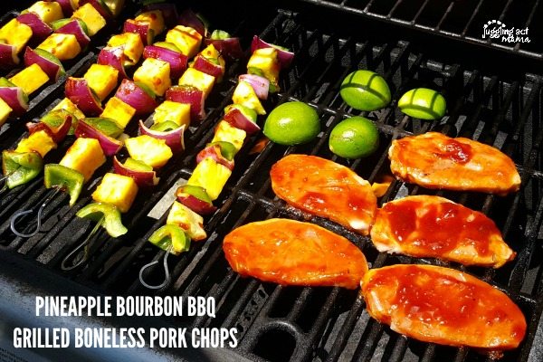 Pork chops and vegetable kabobs on the grill.
