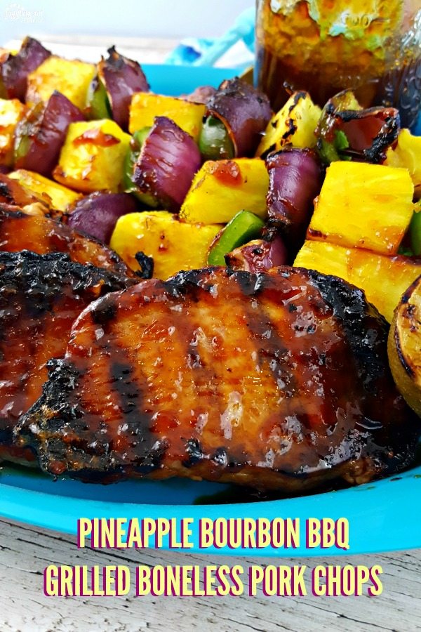 Close up image of Pineapple Bourbon BBQ Grilled Boneless Pork Chops and vegetable kabobs.