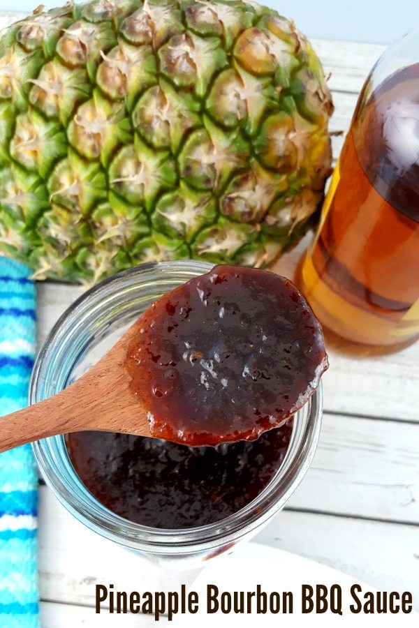 Pineapple bourbon BBQ Sauce on a spoon.