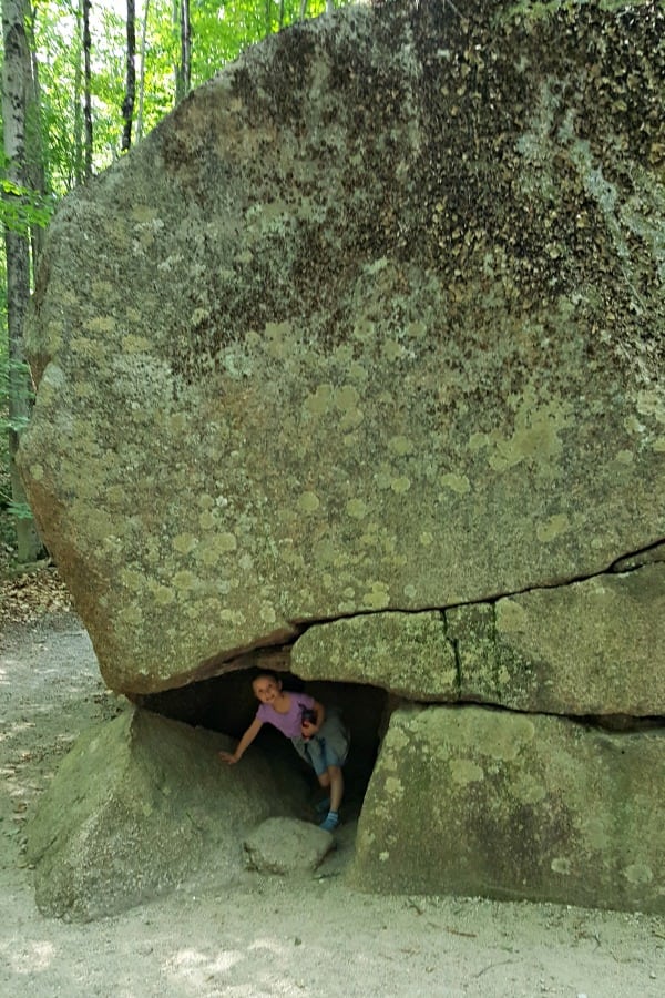 Flume Gorge NH: Girl underneath the corn of a huge rock.