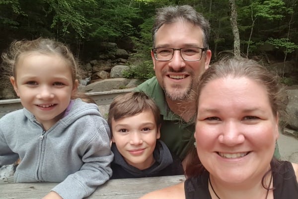 Smiling family of four.