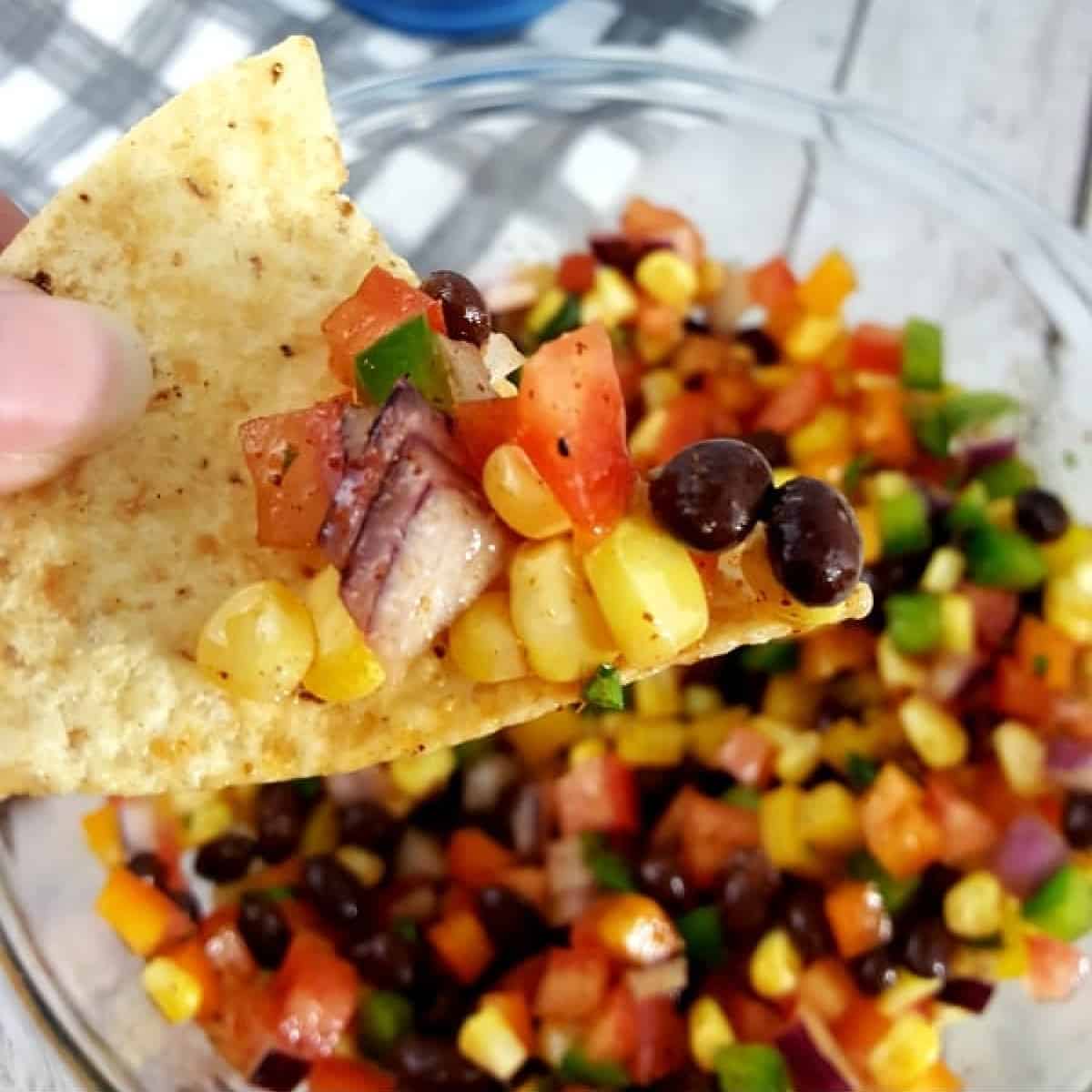 Close up of cowboy caviar on a chip.