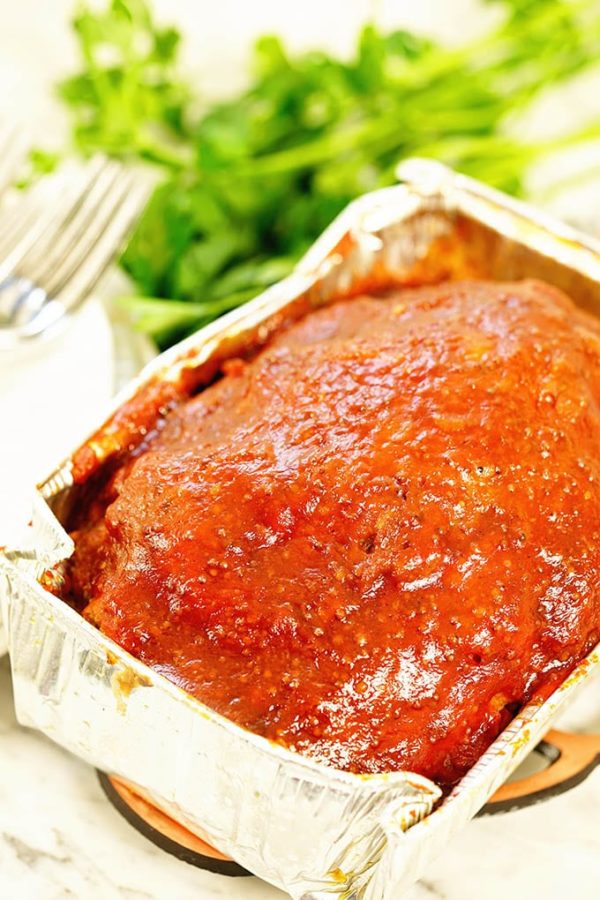 An aluminum pan with Instant Pot Meatloaf ready to be served.