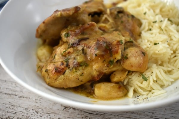 40 Clove Garlic Chicken in a white dish with long grain rice.