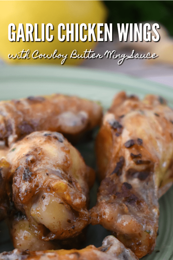 Close up of Air Fryer Garlic Chicken Wings with Cowboy Butter Wing Sauce.