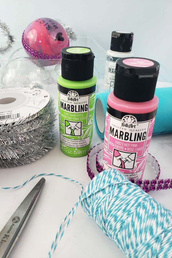 Items you'll need to create marbled Christmas ornaments. 