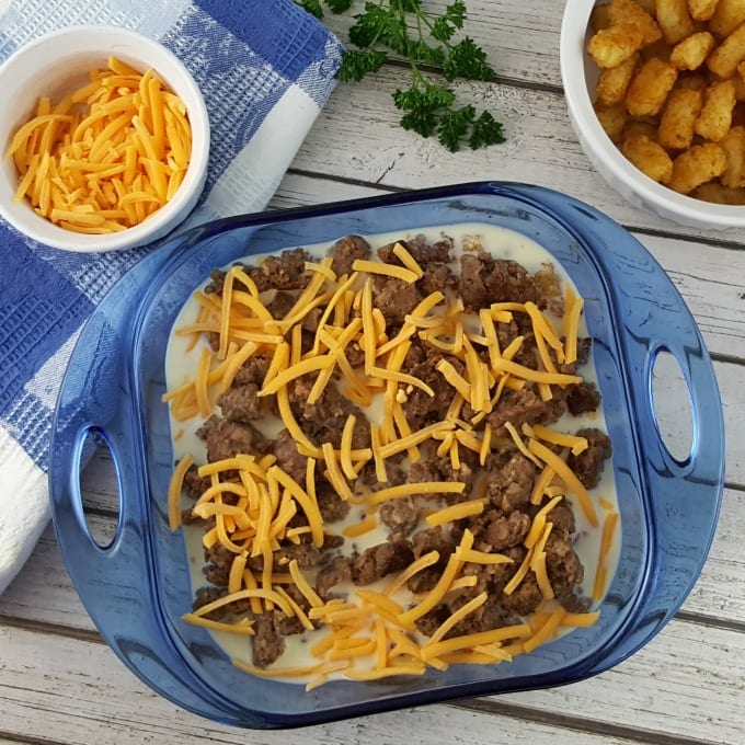 Top down view of Tater Tot Breakfast Casserole in a blue baking dish.