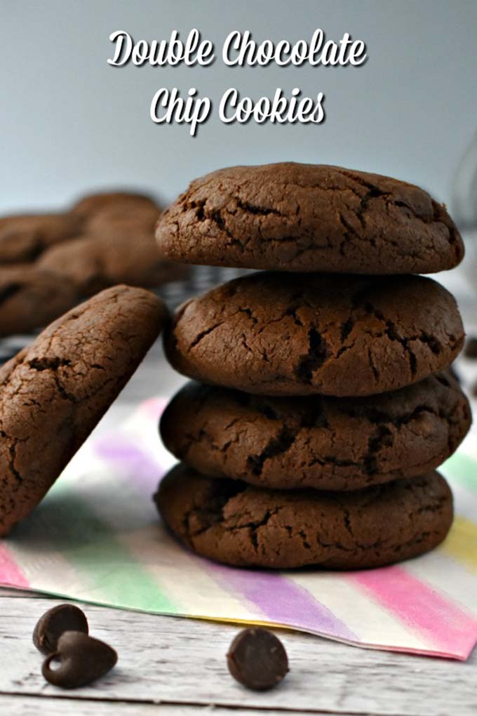 A pile of Double Chocolate Chip Cookies on a napkin.