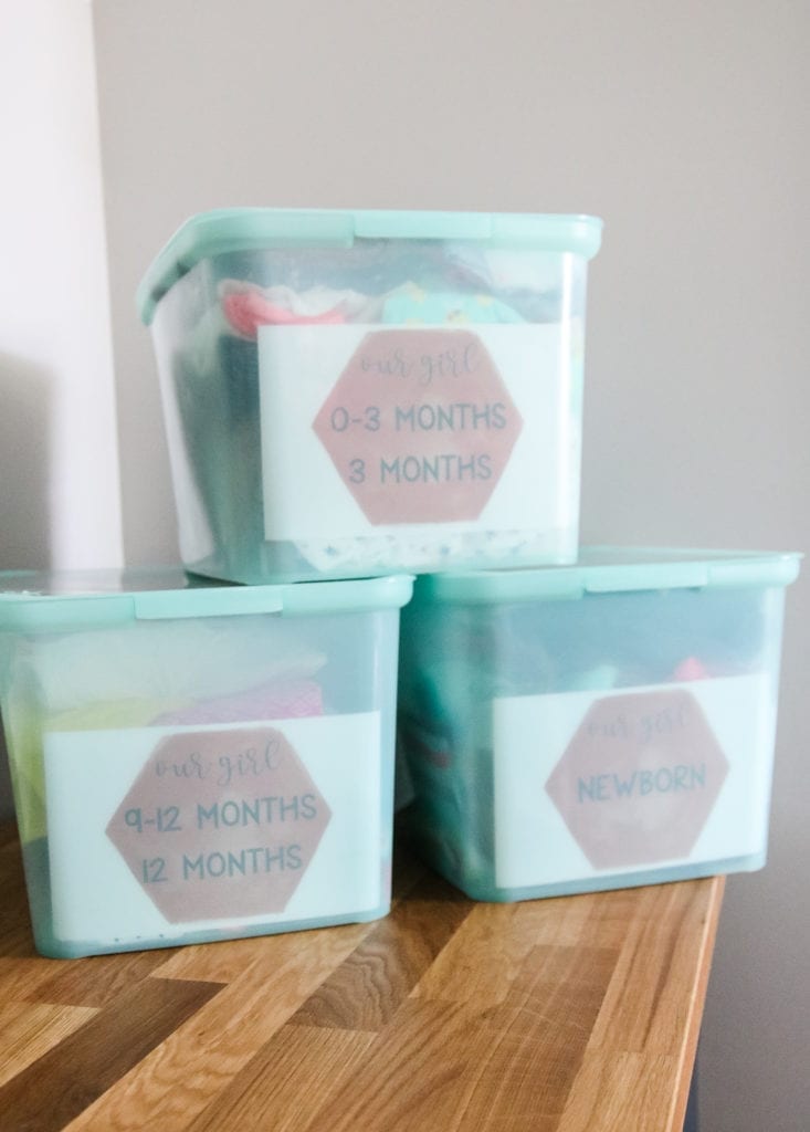 Kid's clothes printables for girls inside plastic bins filled with clothing.