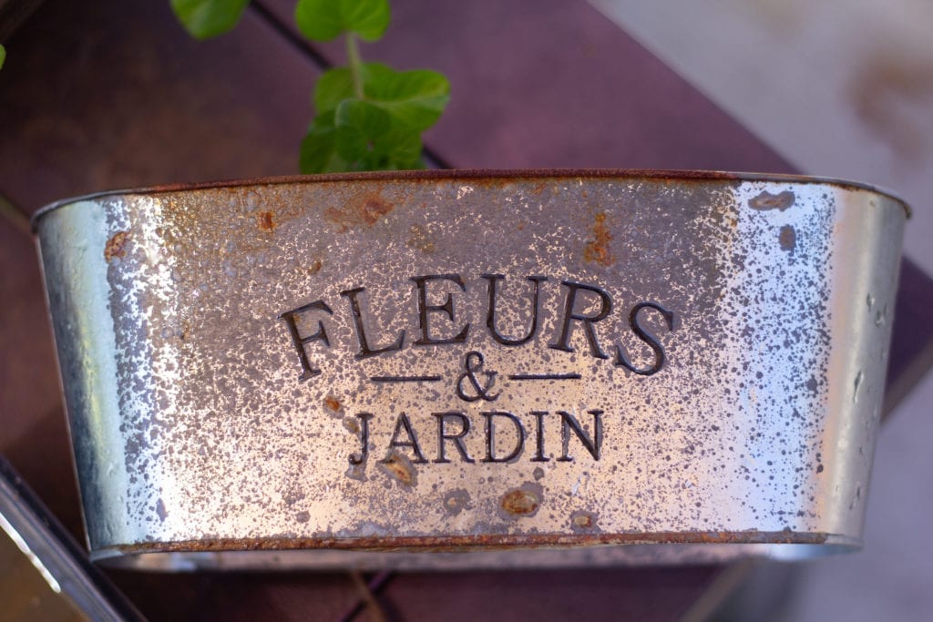 Small metal planter aged with vinegar and hydrogen peroxide.