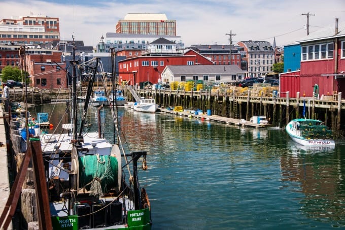 Scenic view of working fishing ships and boats, dockside in Portland Maine's harbor.