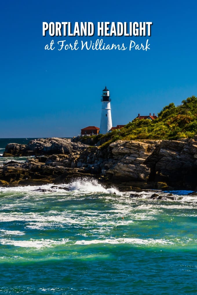 Rocky coast and view of Portland Head Light, at Fort Williams Park, Cape Elizabeth, Maine.