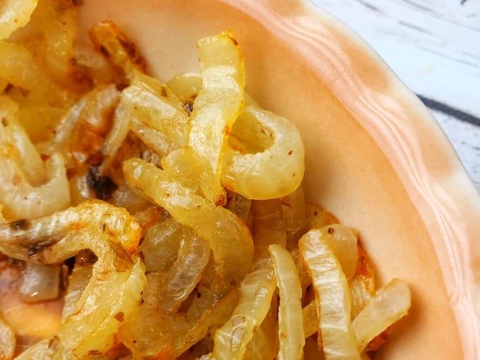 Tender sweet onions go on top of the butter burger.
