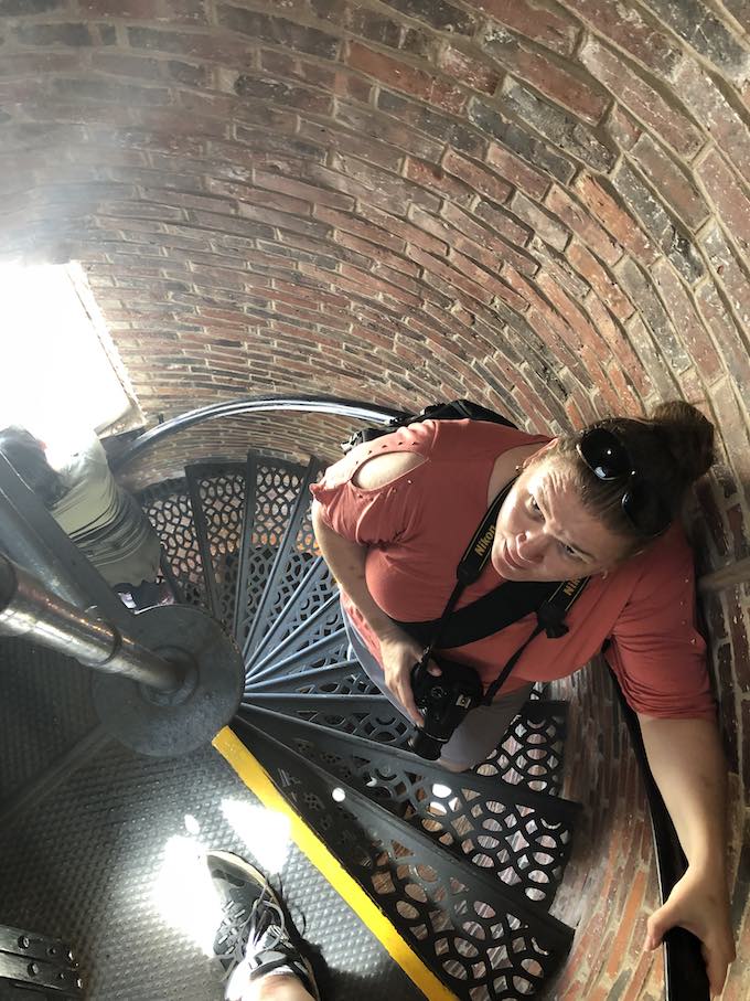 Woman on staircase in Pemaquid Point Lighthouse