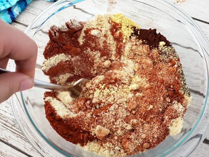A mixing bowl with the spices for pork rub seasoning.